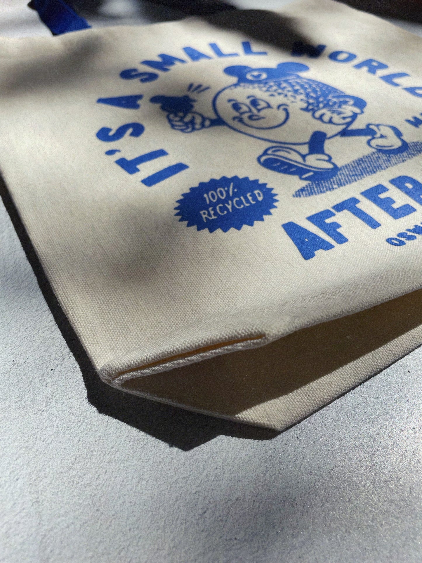 A tote bag featuring a stylish blue and white design, ideal for shopping or casual outings.