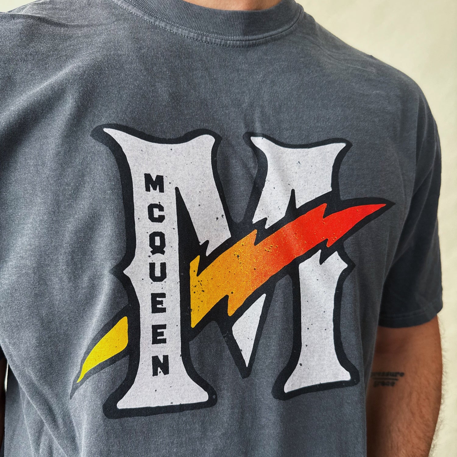 Gray Lighting McQueen T-Shirt with stylized 'M' and lightning bolt