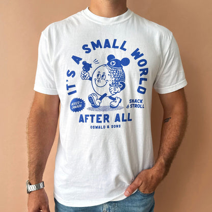 A man wearing a white crewneck Sammy Small World t-shirt from Oswald & Sons